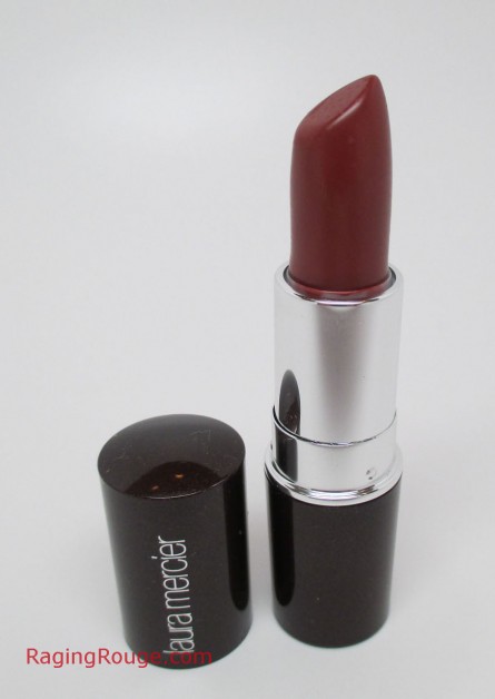 Laura Mercier Pomegranate Stickgloss works year-round, and delivers a sheer pop of color that feels great on the lips.